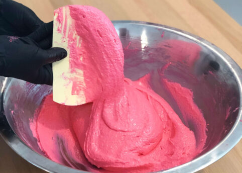 Pink Macaron batter in bowl